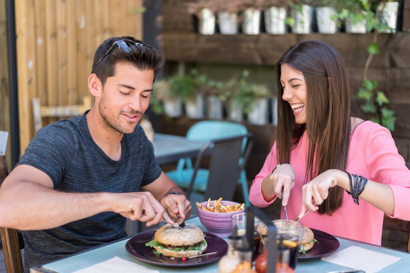 couple dining on a patio in summer
